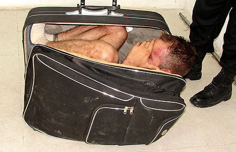 HILARIOUS!!! Woman Tries to Wheel her Husband out of Prison in a Suitcase